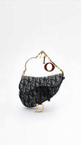 Dior Monogram Mini Saddle Wristlet Bag