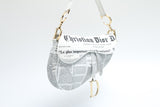 Dior Newspaper Print Saddle Bag