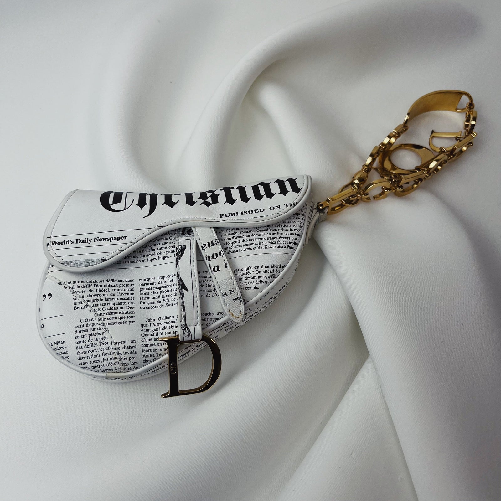 Dior newspaper saddle bag hotsell
